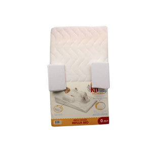 A bed with the Kd Group Reflux Baby BED